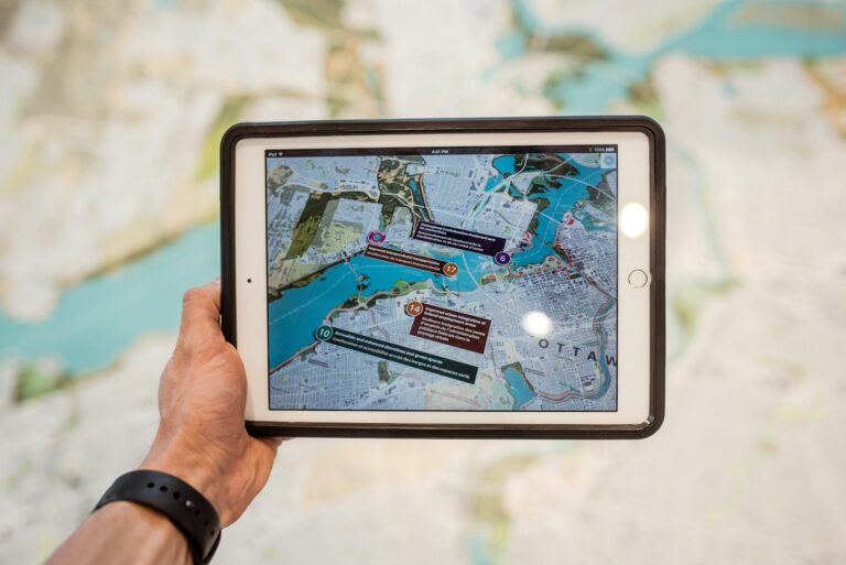 AR 介紹 person holding white ipad with black case