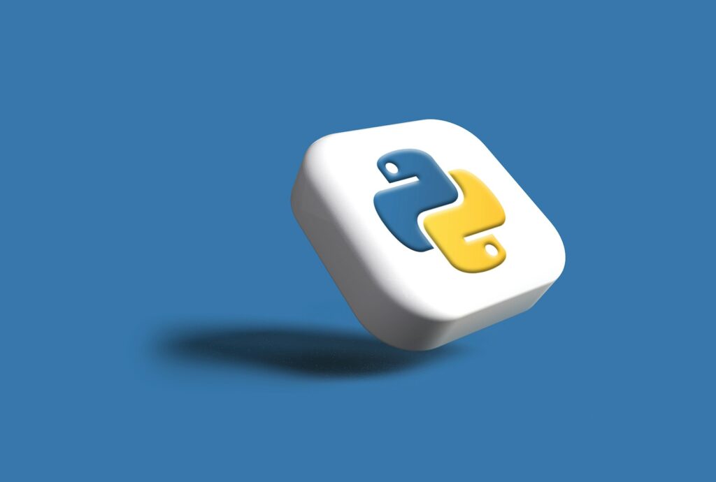 Python 介紹 a white cube with a yellow and blue logo on it